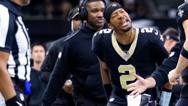 Jan 7, 2024; New Orleans, Louisiana, USA; New Orleans Saints quarterback Jameis Winston (2) greets quarterback Derek Carr (4) after a touchdown pass against the Atlanta Falcons during the first half at Caesars Superdome. Mandatory Credit: Stephen Lew-USA TODAY Sports